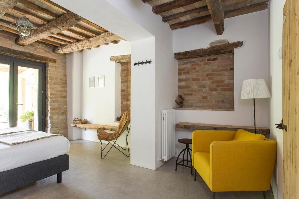 Postel nebo postele na pokoji v ubytování Agriturismo Unico Senso