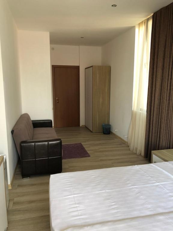 Postel nebo postele na pokoji v ubytování M-Rooms