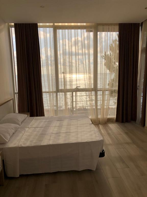 Postel nebo postele na pokoji v ubytování M-Rooms
