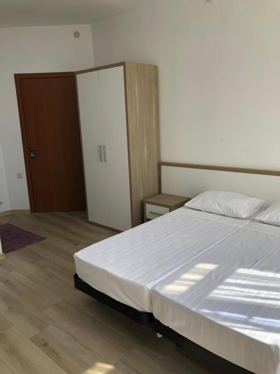 Postel nebo postele na pokoji v ubytování M-Rooms