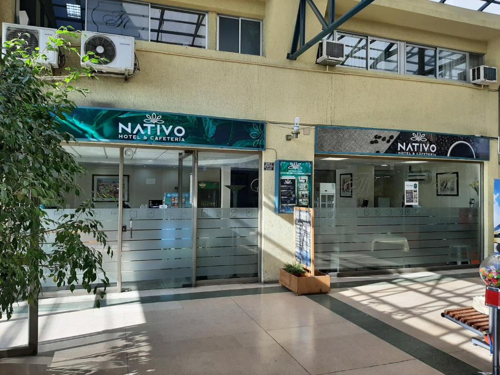 a nikko shop with its doors open on a building at Nativo Hotel y Cafeteria in Talca