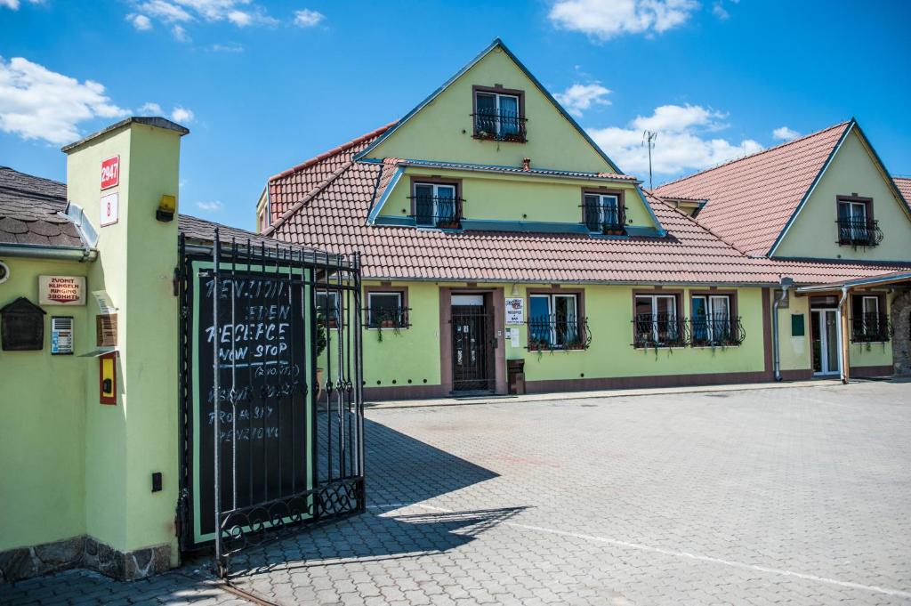a building with a gate in front of it at Penzion Eden in Znojmo