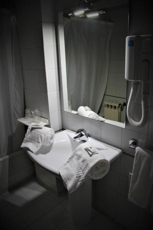 Postel nebo postele na pokoji v ubytování Hotel de Arganil