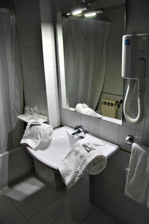 Postel nebo postele na pokoji v ubytování Hotel de Arganil