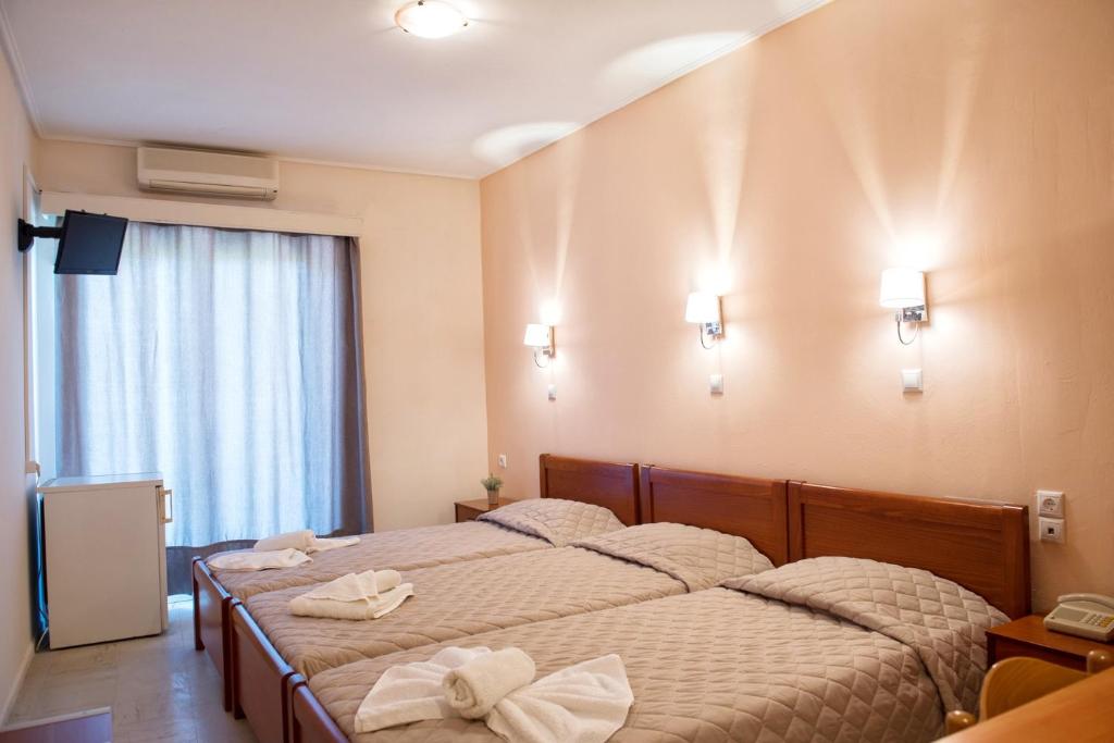 Postel nebo postele na pokoji v ubytování Hotel Solon