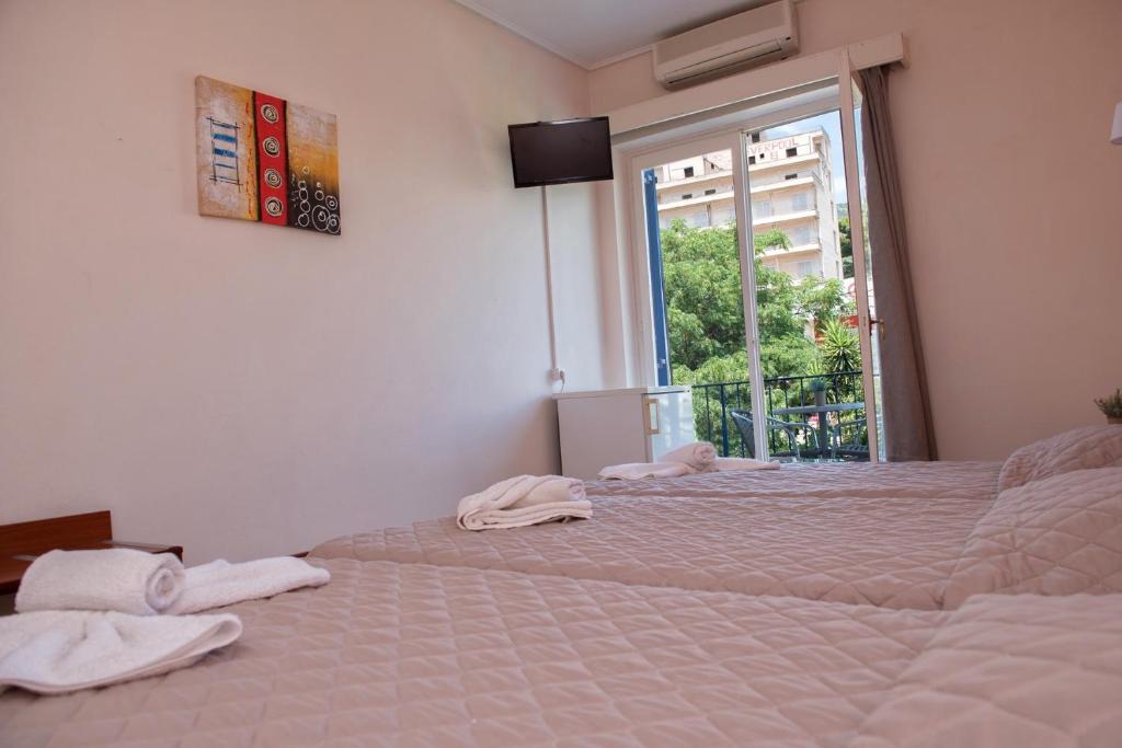 Postel nebo postele na pokoji v ubytování Hotel Solon