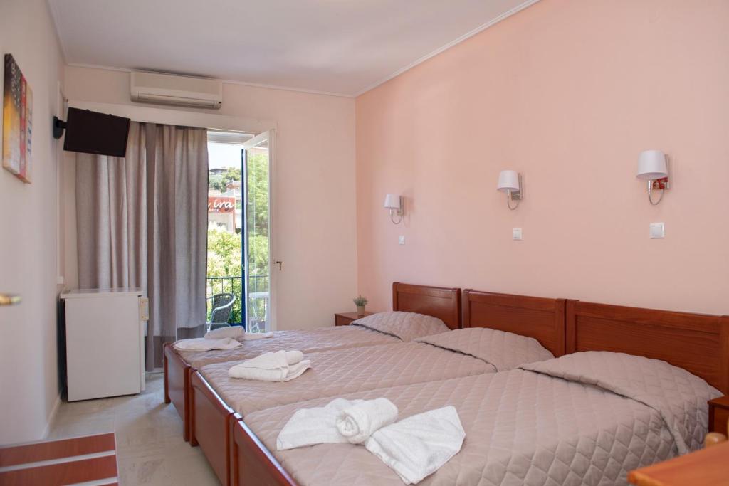 Postel nebo postele na pokoji v ubytování Hotel Solon