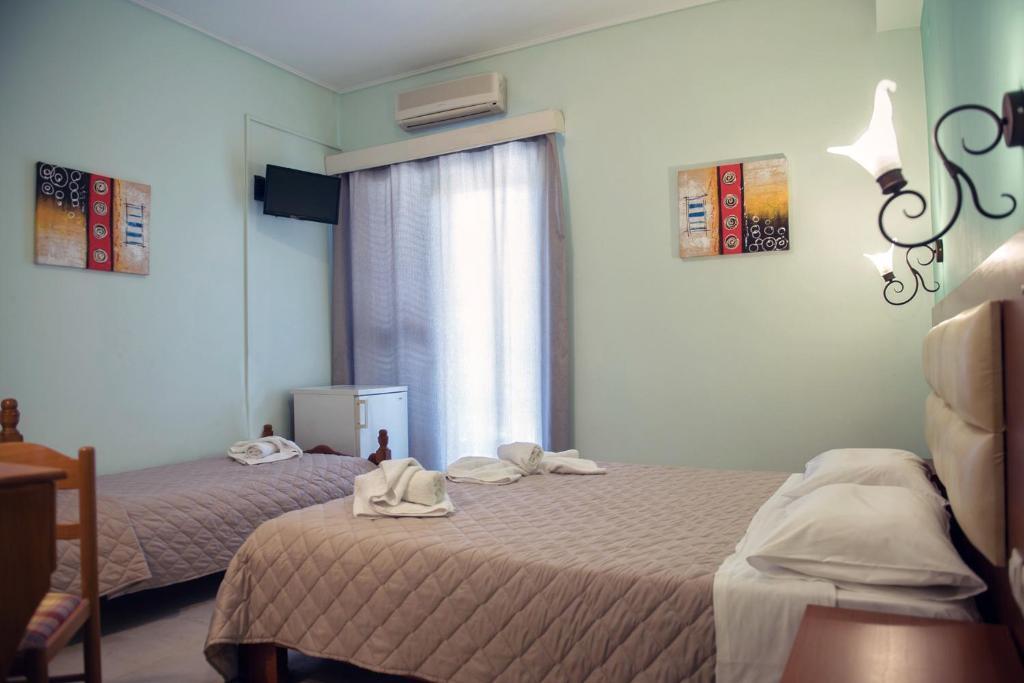 Postel nebo postele na pokoji v ubytování Hotel Solon