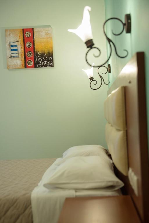 Postel nebo postele na pokoji v ubytování Hotel Solon