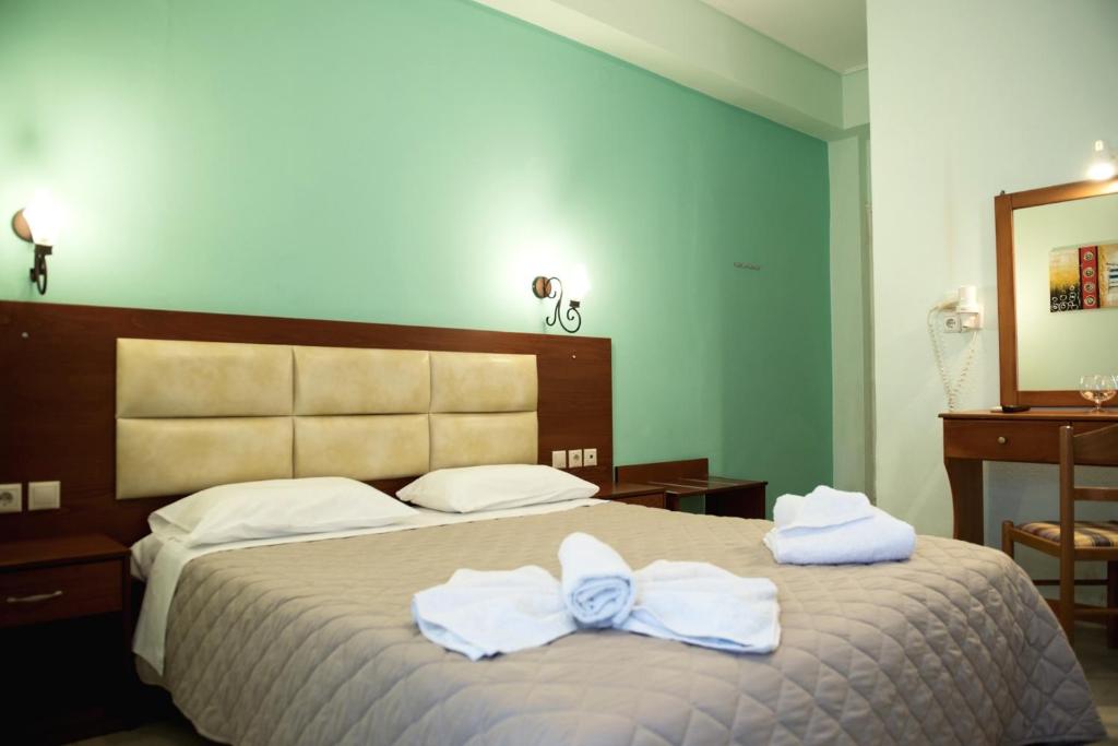 Postel nebo postele na pokoji v ubytování Hotel Solon
