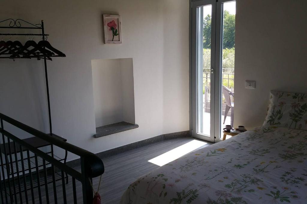 Postel nebo postele na pokoji v ubytování piccolo casale a "le Moline" in una vera fattoria