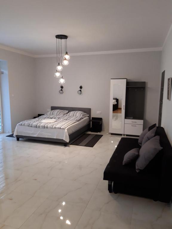 Łóżko lub łóżka w pokoju w obiekcie Apartamenty Polna