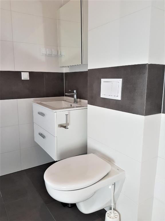Koupelna v ubytování Apartamenty Tęczowa 14 Sarbinowo