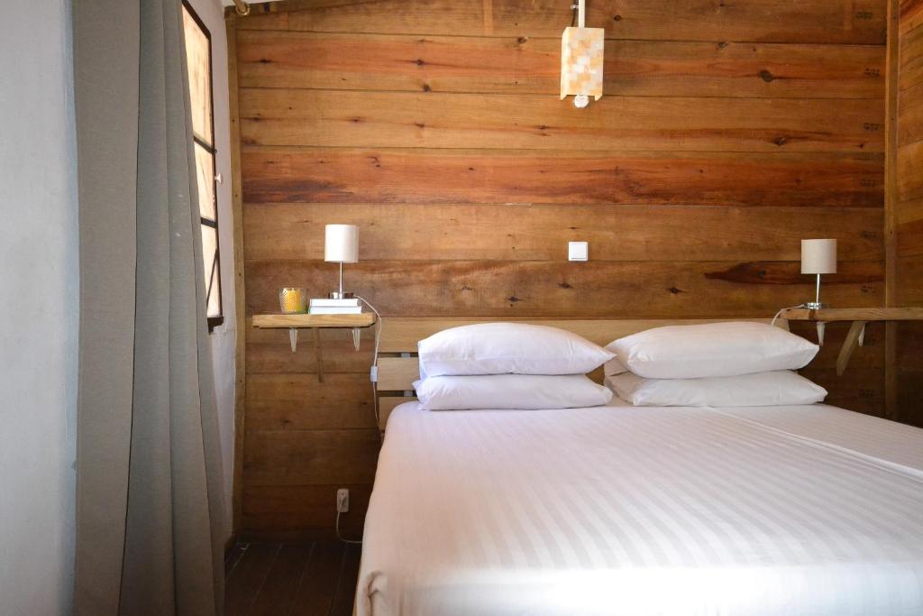 Postel nebo postele na pokoji v ubytování Jan Kok Lodges