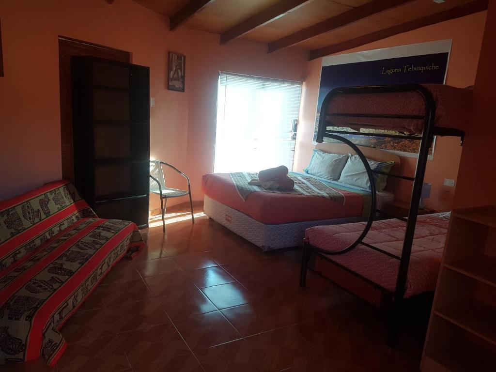 Postel nebo postele na pokoji v ubytování Hostal Nuevo Sol y Viento