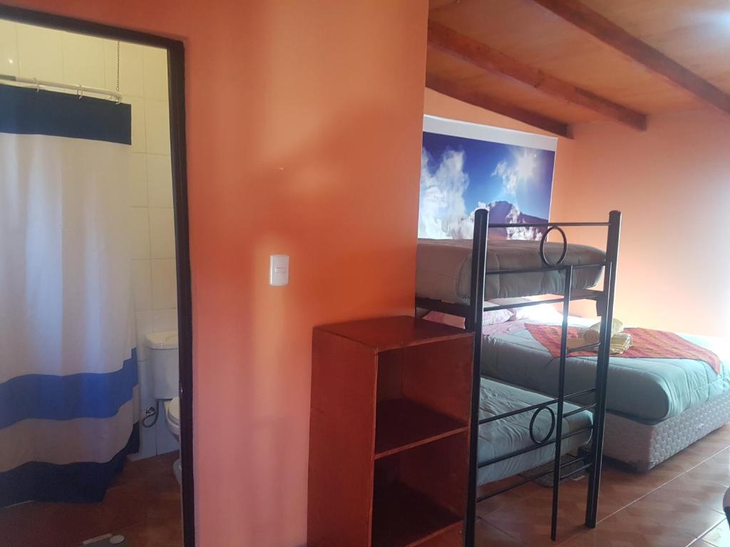 Postel nebo postele na pokoji v ubytování Hostal Nuevo Sol y Viento