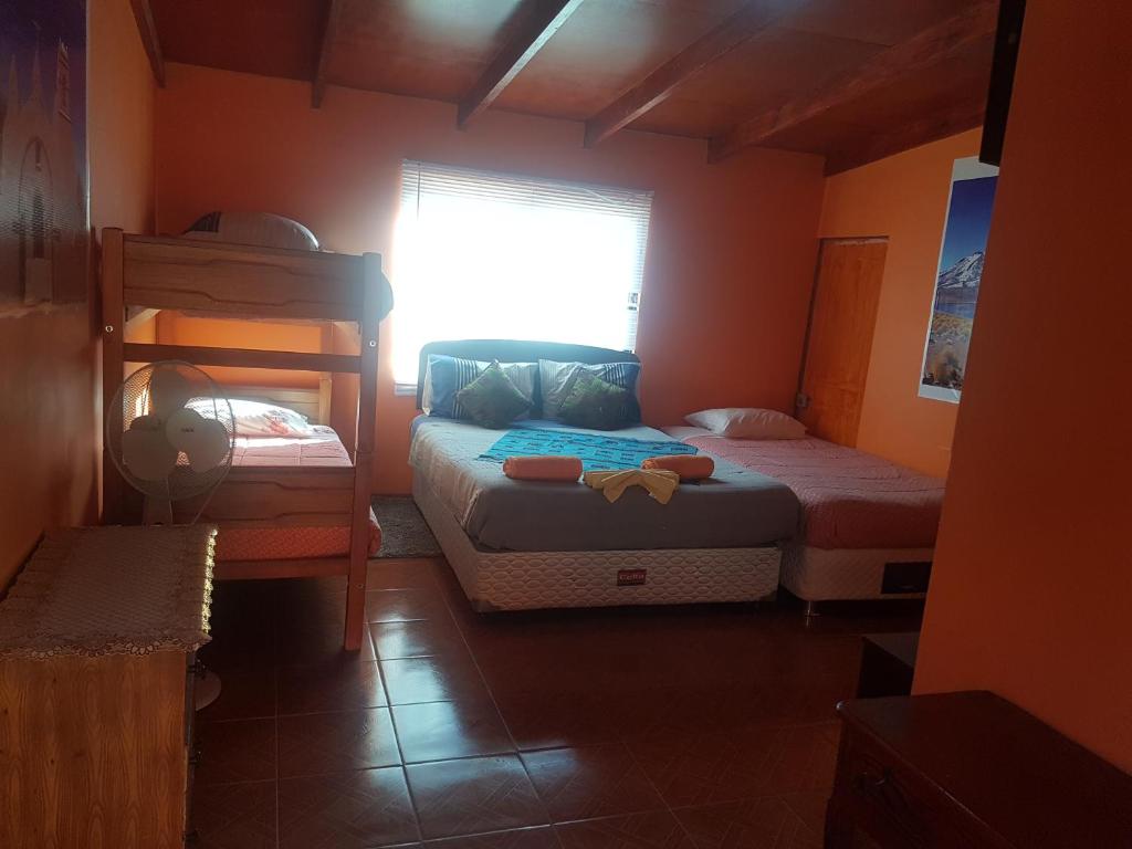 Postel nebo postele na pokoji v ubytování Hostal Nuevo Sol y Viento
