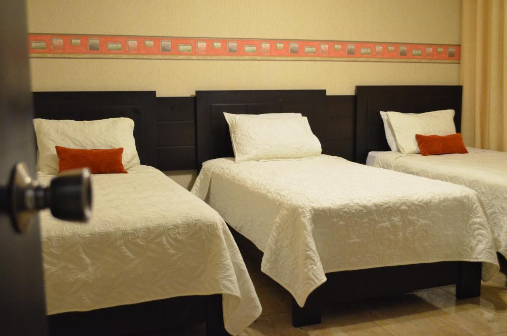 Postel nebo postele na pokoji v ubytování Monterrico Hotel Perú
