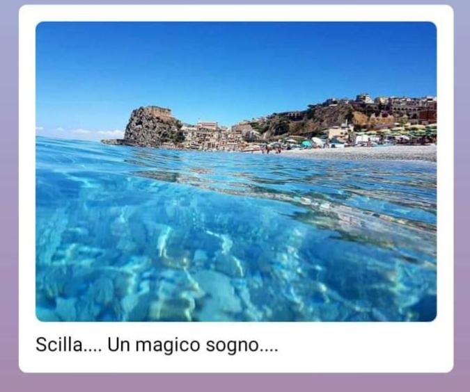 a view of a beach and the ocean at Da zio Michele in Scilla