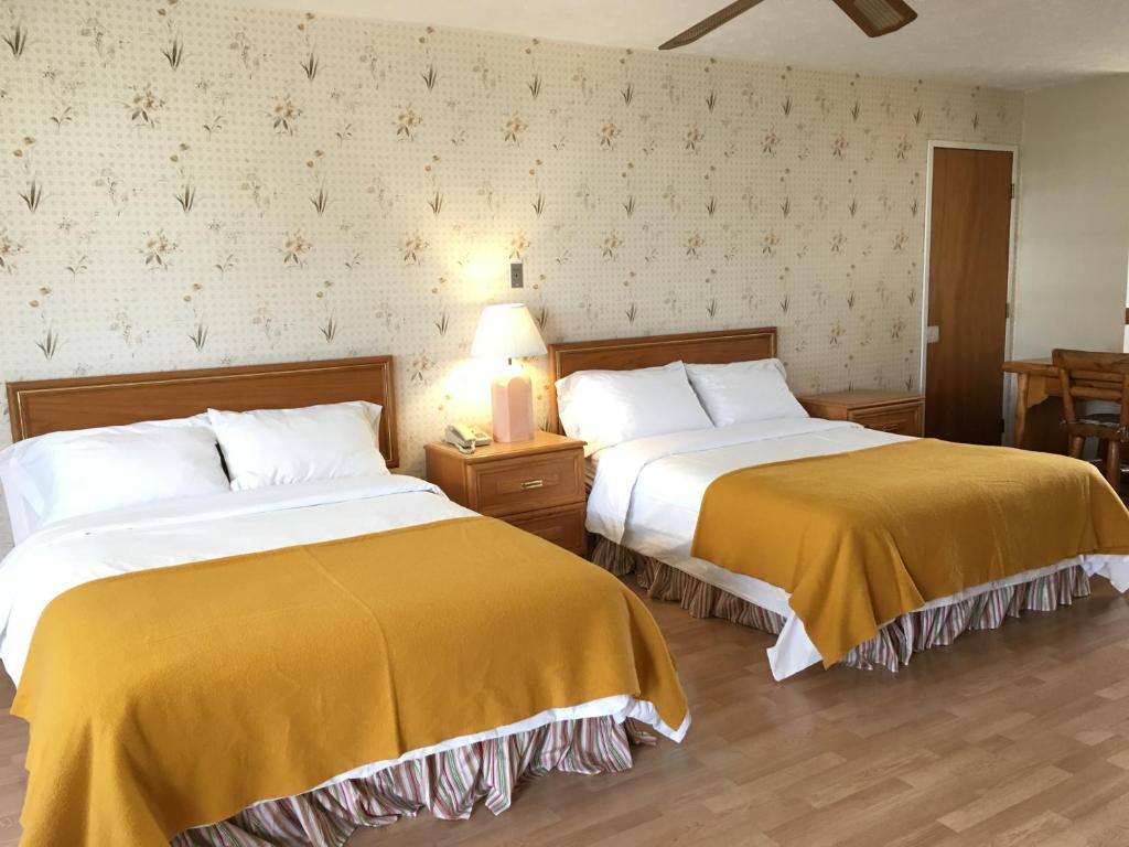 Postel nebo postele na pokoji v ubytování Motel le Sabre
