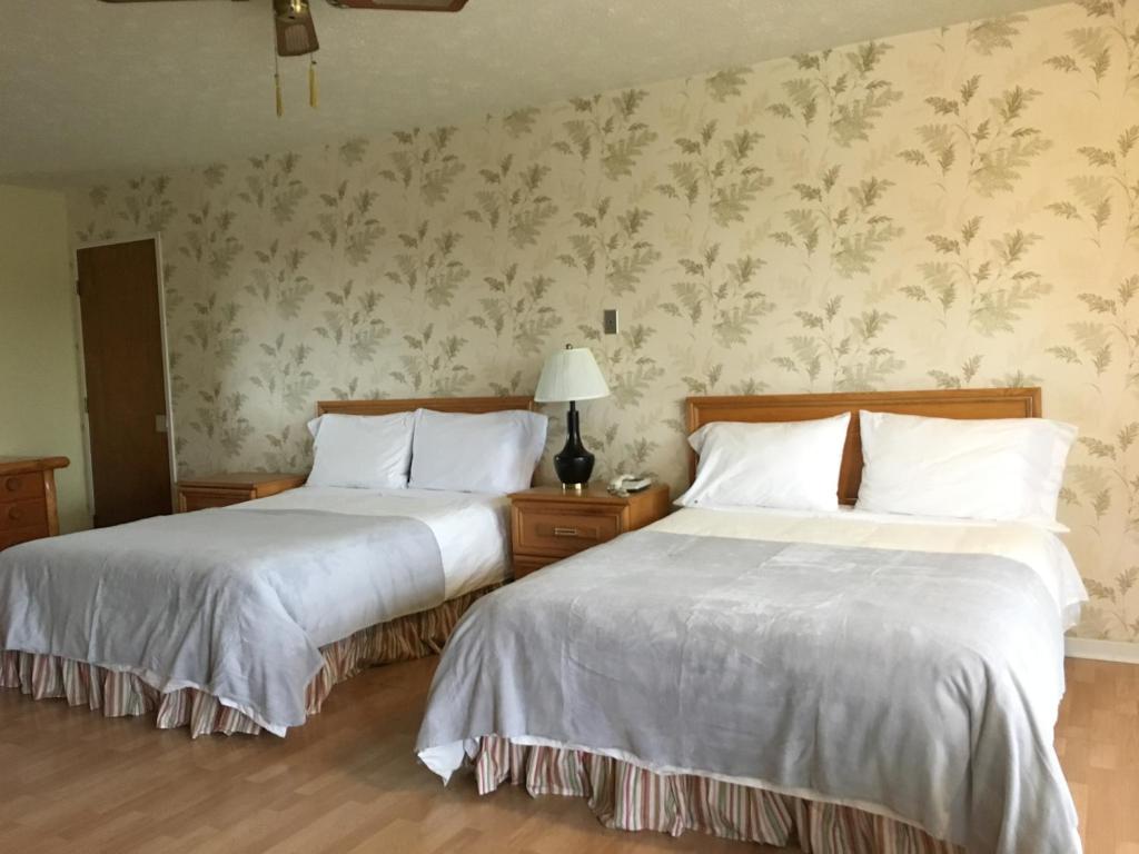 Postel nebo postele na pokoji v ubytování Motel le Sabre