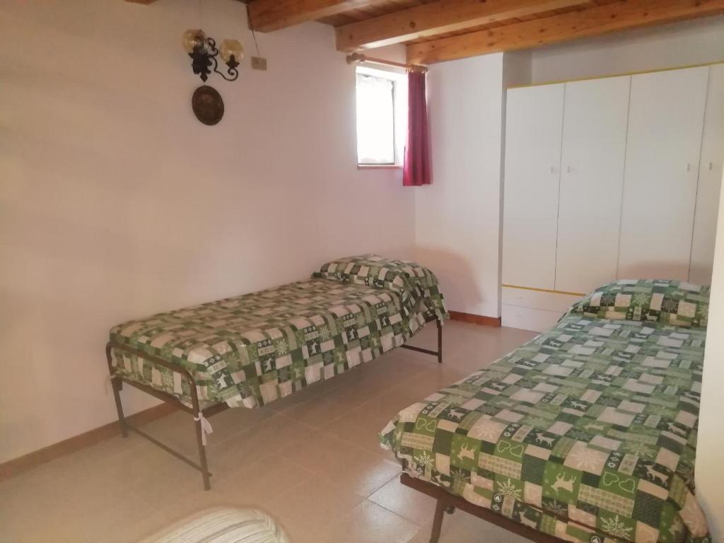 Postel nebo postele na pokoji v ubytování Maison Cenne Vda Gressan n 0030