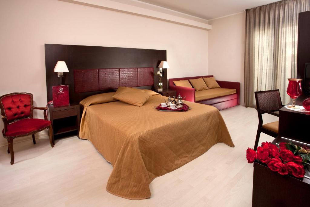 Postel nebo postele na pokoji v ubytování Hotel Capitol