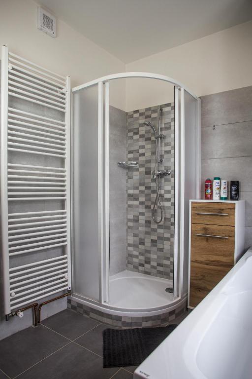 Postel nebo postele na pokoji v ubytování Apartmány Ve Mlejně