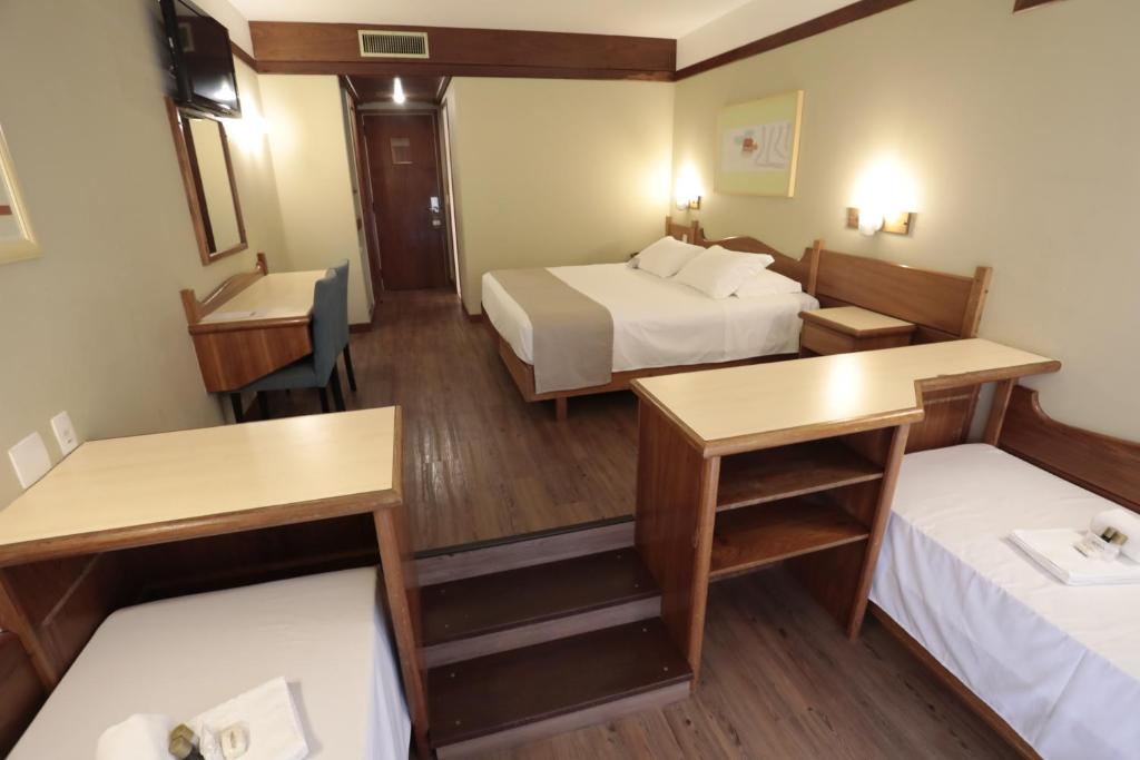 Postel nebo postele na pokoji v ubytování Tri Hotel