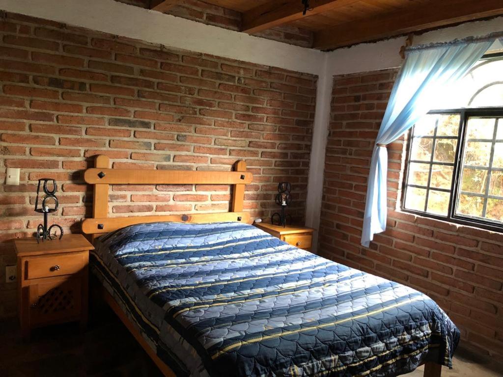 Postel nebo postele na pokoji v ubytování Cabañas las Alazanas