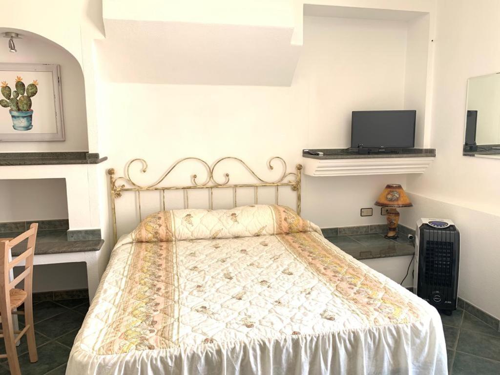 Postel nebo postele na pokoji v ubytování B&B S'Incontru