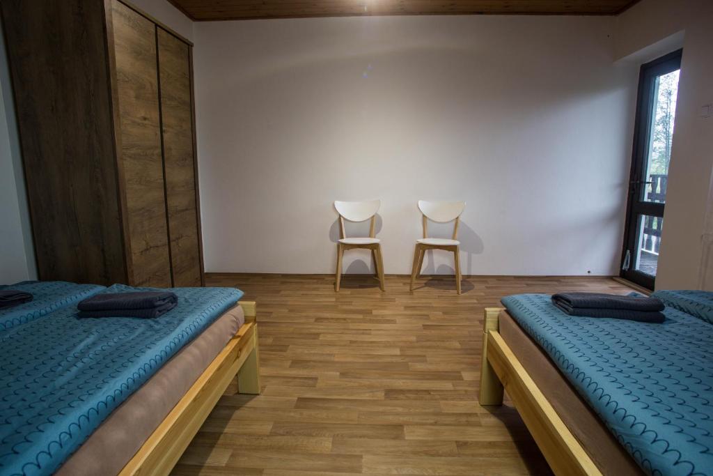 Postel nebo postele na pokoji v ubytování Apartmány Ve Mlejně