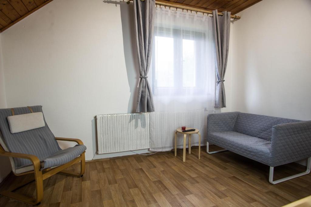 Posezení v ubytování Apartmány Ve Mlejně