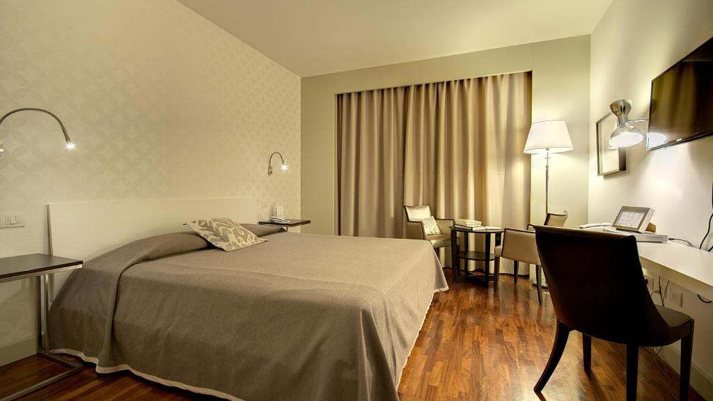 Posteľ alebo postele v izbe v ubytovaní Hotel Datini