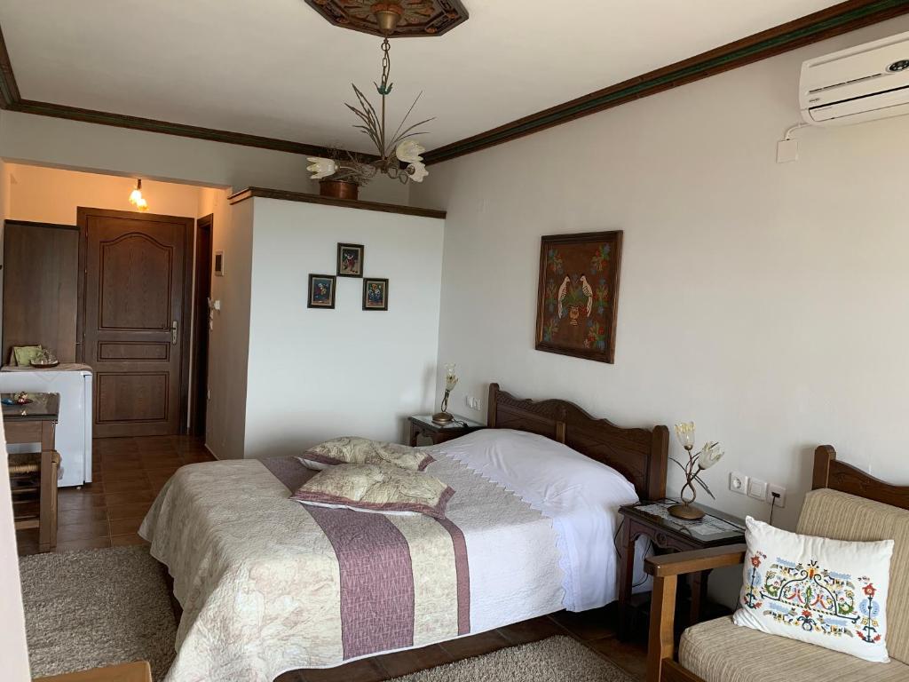 Postel nebo postele na pokoji v ubytování Iliovolo Guesthouse