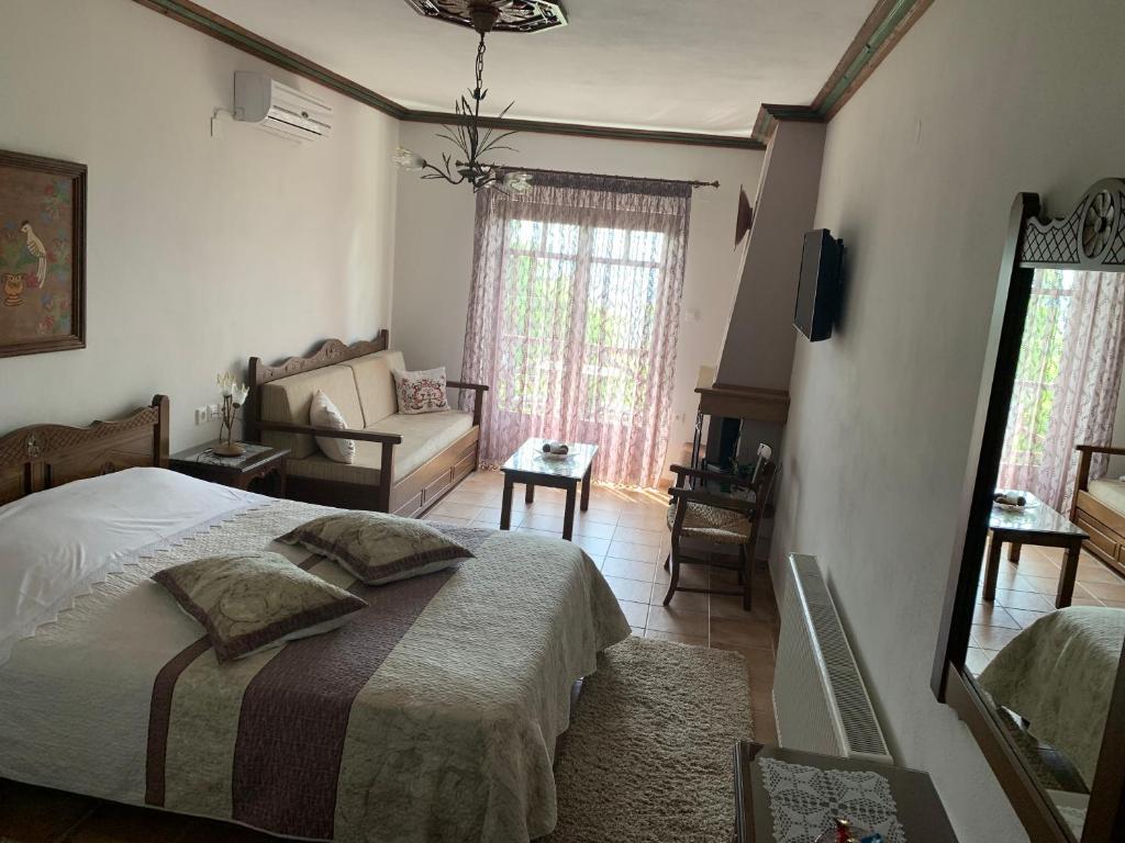 Postel nebo postele na pokoji v ubytování Iliovolo Guesthouse
