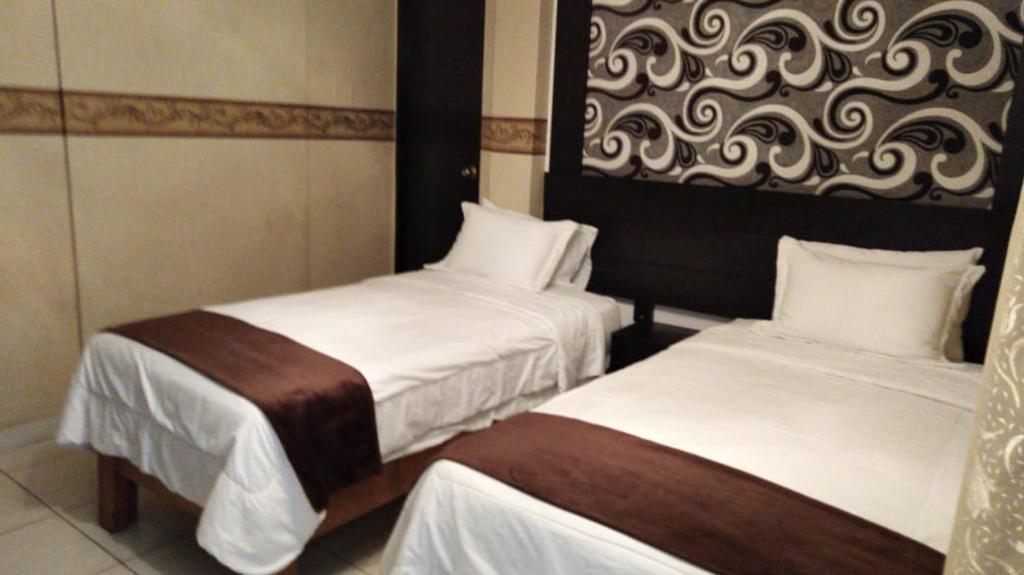Postel nebo postele na pokoji v ubytování Monterrico Hotel Perú