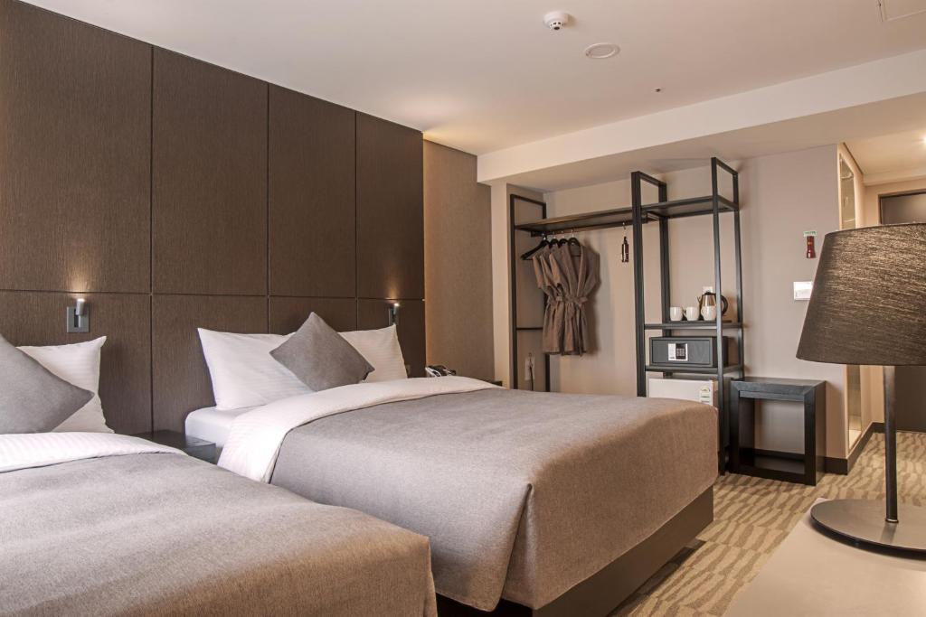 Postel nebo postele na pokoji v ubytování Hotel Foret Premier Nampo