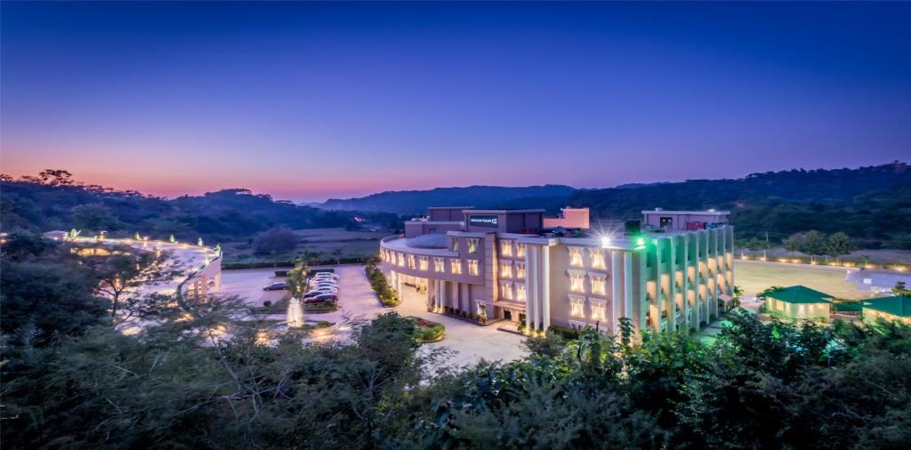 an aerial view of a building at night at Golden Tulip Chandigarh, Panchkula in Chandīgarh
