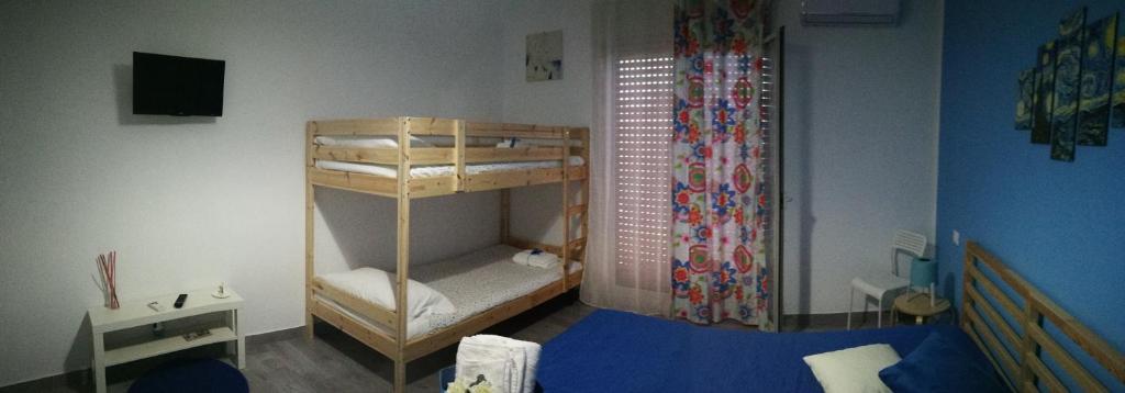 Postel nebo postele na pokoji v ubytování Dimora Fraula Guest House