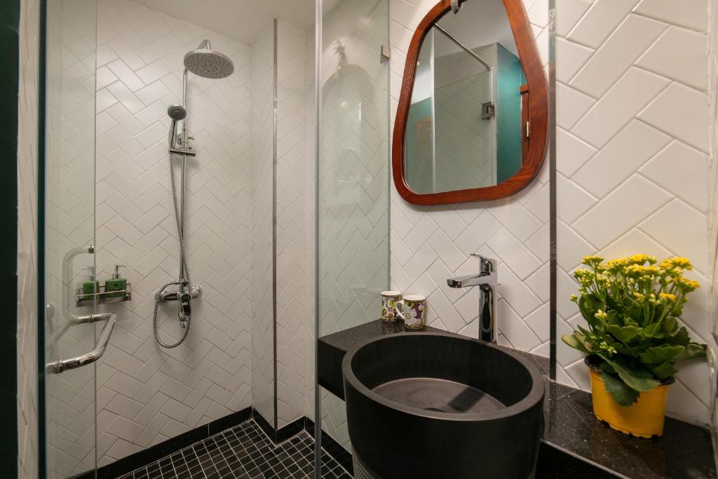 Koupelna v ubytování Hanoi La Selva Central Hotel & Spa