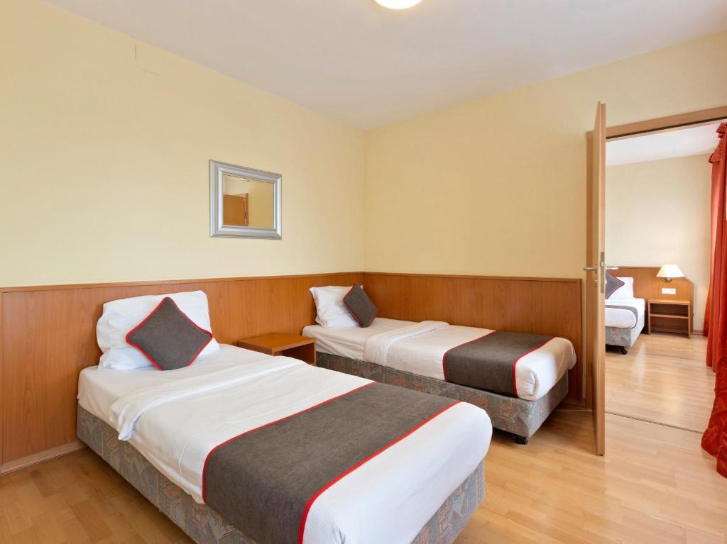 Postel nebo postele na pokoji v ubytování Hotel Bohemia