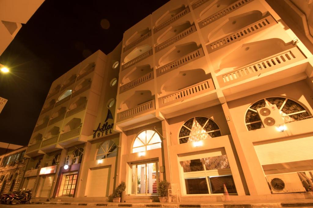 a large building with windows at night at Atlantic Hotel in Djibouti