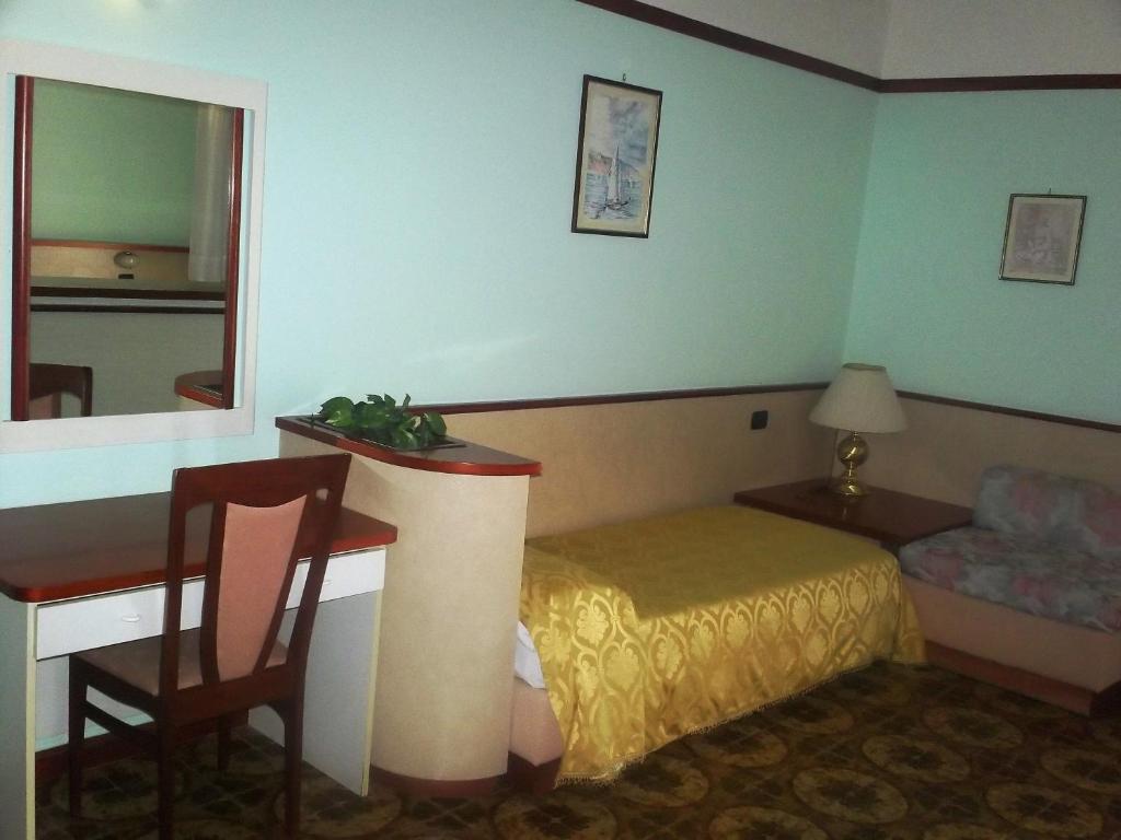 Postel nebo postele na pokoji v ubytování Hotel Gaggiano