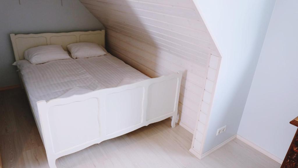 Postel nebo postele na pokoji v ubytování Õhtu Apartments