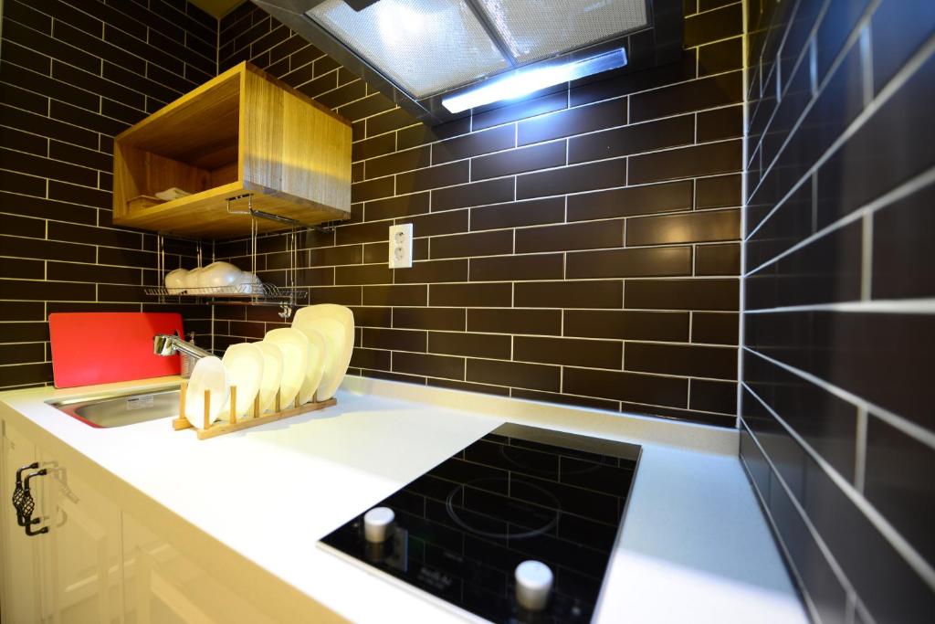 Kuchyň nebo kuchyňský kout v ubytování Dunsan Graytone Hotel