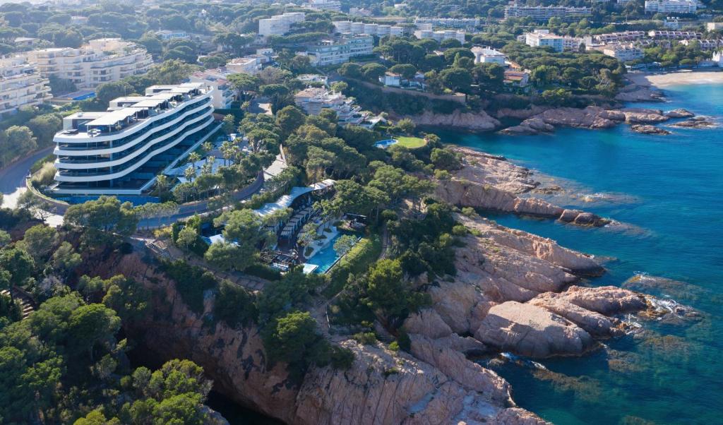 an aerial view of a resort on a cliff at Alàbriga Hotel & Home Suites GL in S'Agaro