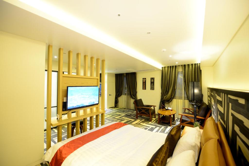 Postel nebo postele na pokoji v ubytování Dunsan Graytone Hotel