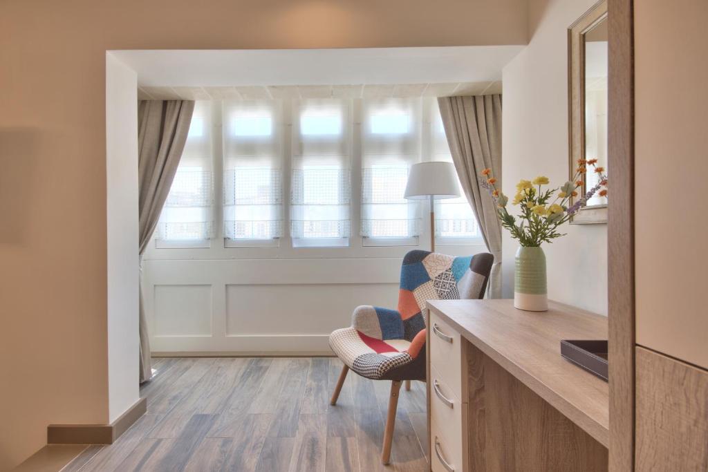 Postel nebo postele na pokoji v ubytování The Suites – Piazza Kirkop