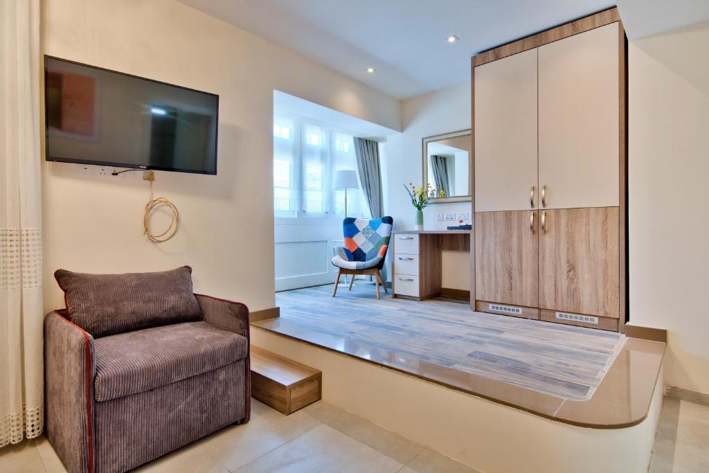 TV a/nebo společenská místnost v ubytování The Suites – Piazza Kirkop